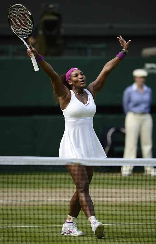 Serena Williams celebrates after defeating Victoria Azarenka in their women's semi-final match at the Wimbledon
