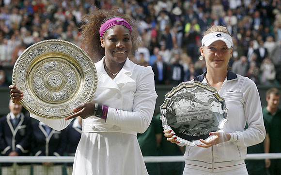 Serena Williams and Agnieszka Radwanska with their trophies at the presentation ceremony