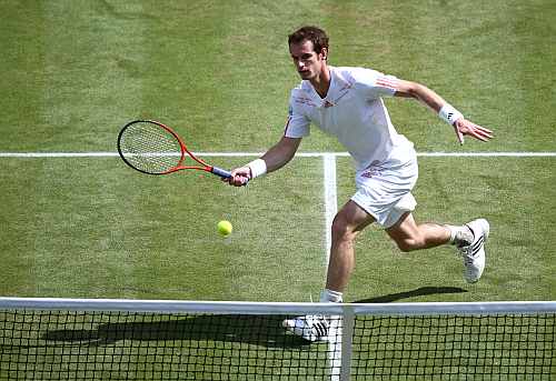 Andy Murray returns a shot during his Men's singles final match against Roger Federer at the Wimbledon
