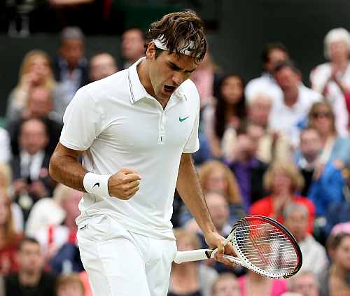 Roger Federer celebrates a point during his Men's singles final match against Andy Murray