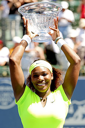 Serena Williams poses for photographers after her win over Coco Vandeweghe in the Stanford Open final on Sunday