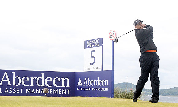 Jeev Milkha Singh of India tees off on the 5th hole during the final round of the Scottish Open on Sunday