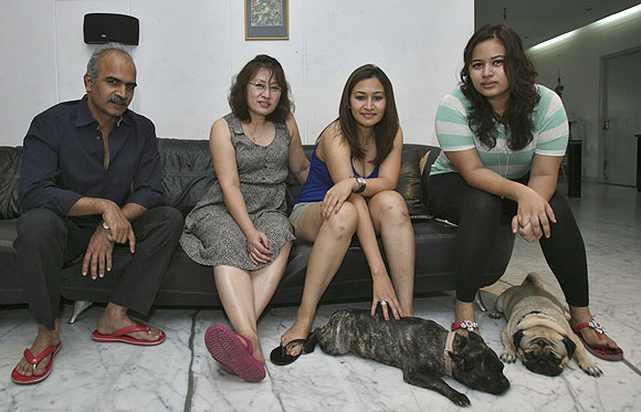 India's badminton player Jwala Gutta (centre) with her sister Insi Gutta (right), mother Yelan Gutta (2nd from left) and father Kranti Gutta