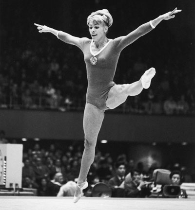 Soviet gymnast Larissa Latynina of the Ukraine in action during the women's compulsory exercises at the Tokyo Olympics