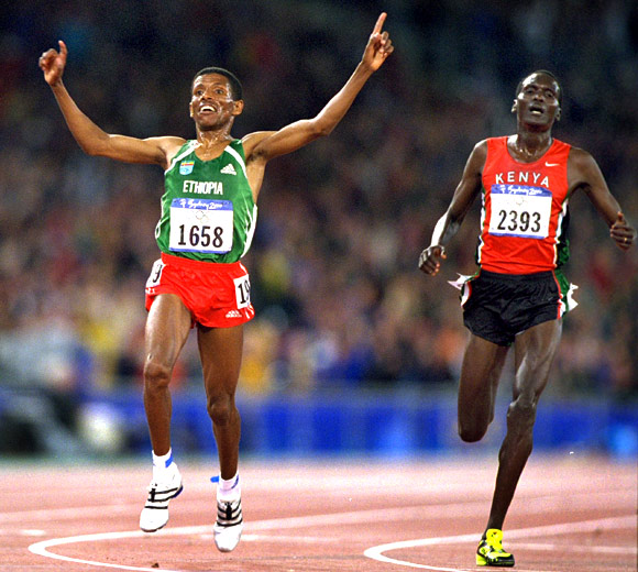 Haile Gebrselassie of Ethiopia beats Paul Tergat of Kenya (right) in the Mens 10000m Final at the Olympic Stadium on Day Ten of the Sydney 2000 Olympic Games in Sydney