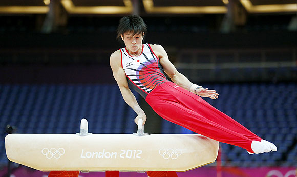 Kohei Uchimura of Japan practices on the pommel horse during a training session at the O2 Arena in London