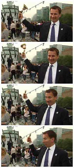 A combination of still images taken from a video grab shows British Secretary of State for Culture, Olympics, Media and Sport Jeremy Hunt ringing an Olympic bell which flew off its handle in London on Friday