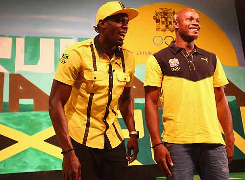 Usain Bolt (L) and Asafa Powell (R) during the Team Jamaica Press Conference at U Block Event Space