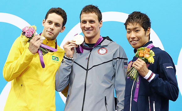 Silver medallist Thiago Pereira of Brazil (left) gold medallist Ryan Lochte of the United States and bronze medallist Kosuke Hagino of Japan celebrate on the podium after winning the 400m individual medley