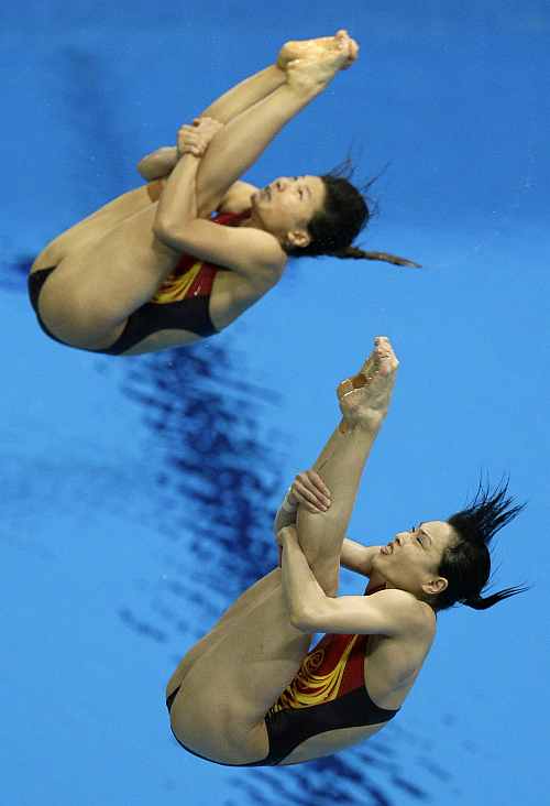 Gold medalists Wu Minxia, front, and He Zi, rear, compete during the 3 Meter Synchronized Springboard final at the Aquatics Centre in the Olympic Park