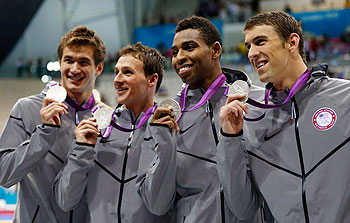 Adrian Nathan, Ryan Lochte, Cullen Jones and Michael Phelps of the United States pose with the silver medals won during the Men's 4 x 100m Freestyle Relay final on Sunday
