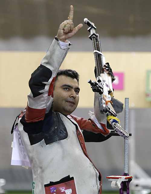 India's Gagan Narang celebrates winning the bronze medal at the end of the men's 10-meter air rifle