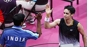 Kashyap gets a high-five from coach Pulela Gopichand