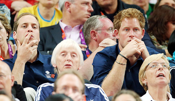 Britain's Princes William and Harry watch the Artistic Gymnastics Men's Team final on Monday