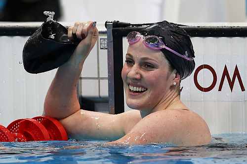 Missy Franklin of the United States celebrates after she won the Final of the Women's 100m Backstroke