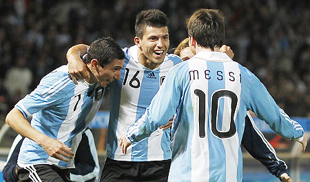 Argentina's Sergio Aguero (centre) celebrates with teammates Angel Di Maria (left) and Lionel Messi