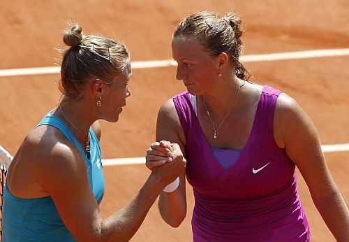 Petra Kvitova of the Czech Republic (R) shakes hands with Nina Bratchikova of Russia after winning her match during the French Open