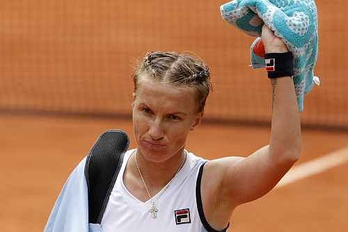 Svetlana Kuznetsova of Russia leaves the court after losing her match against Sara Errani of Italy during the French Open