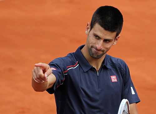 Novak Djokovic of Serbia reacts during his match against Andreas Seppi of Italy during the French Open