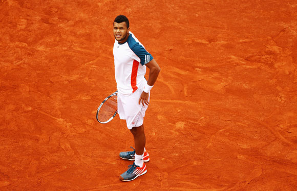 Jo-Wilfried Tsonga of France looks on in his men's singles fourth round match against Stanislas Wawrinka of Switzerland during day 9 of the French Open at Roland Garros on June 4, 2012 in Paris, France