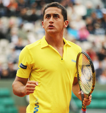 Nicolas Almagro of Spain celebrates in his men's singles fourth round match against Janko Tipsarevic of Serbia during day 9 of the French Open