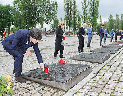 German coach Joachim Loew (left) and Dr. Charlotte Knobloch, President of the Jewish community of Munich and Upper Bavaria (second left) place candles as they pay their respects in memory of the victims of the Nazi regime