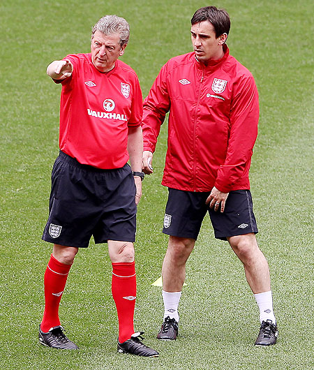 England manager Roy Hodgson (left) talks with Gary Neville