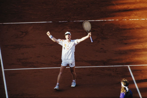 Jim Courier celebrates his defeat of Andre Agassi in the final to win the men's singles title at the French Open
