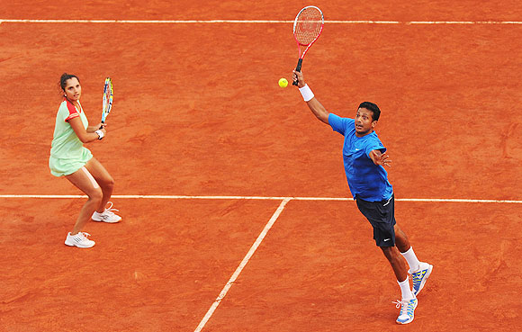 Sania Mirza and Mahesh Bhupathi in action during the mixed doubles final on Thursday