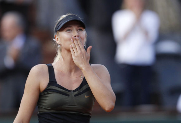 Maria Sharapova of Russia celebrates after winning her women's semi-final match against Petra Kvitova of the Czech Republic at the French Open