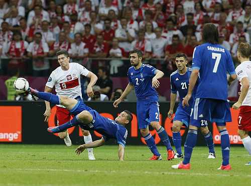 Greece's Papadopoulos kicks ball during the Group A Euro 2012 soccer match against Poland