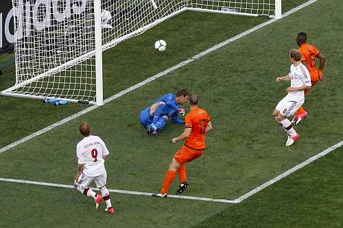 Denmark's Krohn-Dehli scores a goal against Netherlands' goalkeeper Stekelenburg during their Group B Euro 2012 soccer match