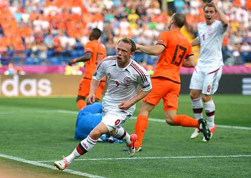 Michael Krohn-Dehli of Denmark turns to celebrate scoring their first goal during the UEFA EURO 2012 group B match between Netherlands and Denmark