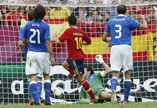 Spain's Cesc Fabregas (C) scores a goal against Italy during their Group C Euro 2012 soccer match at the PGE Arena stadium