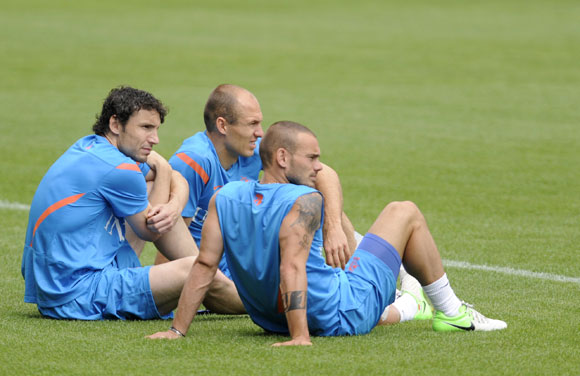 Netherlands' soccer players Mark van Bommel, Arjen Robben and Wesley Sneijder attend a training session during Euro 2012