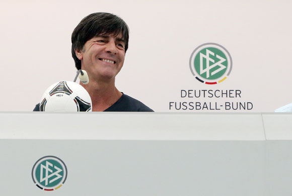 Germany's national soccer coach Joachim Loew smiles during a news conference ahead of their Euro 2012 soccer match against Netherlands