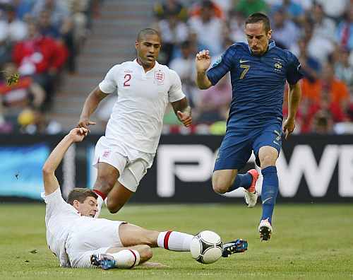 France's Franck Ribery (R) battles for the ball with England's Steven Gerrard (L) and Glen Johnson during the Group D Euro 2012 soccer match against France at Donbass Arena in Donetsk