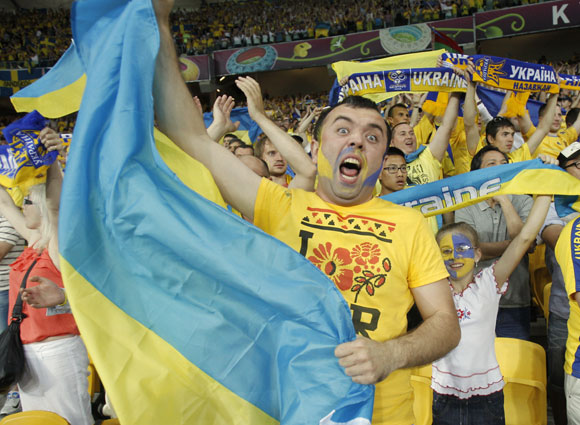 Ukraine's fans celebrate during their Group D Euro 2012 soccer match against Sweden at the Olympic stadium in Kiev