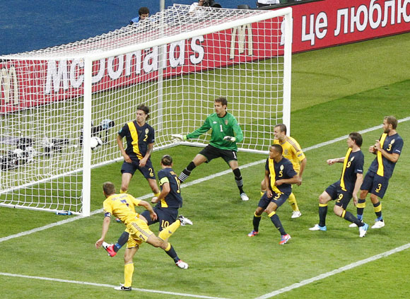 Ukraine's Andriy Shevchenko (L) scores his second goal against Sweden during their Group D Euro 2012 soccer match at the Olympic stadium in Kiev