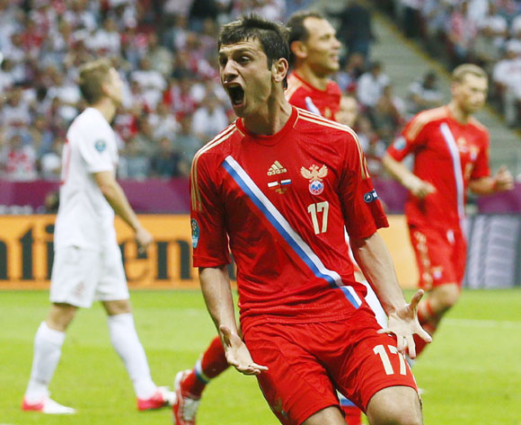 Russia's Alan Dzagoev celebrates after scoring a goal against Poland during their Group A Euro 2012 soccer match at the National stadium in Warsaw