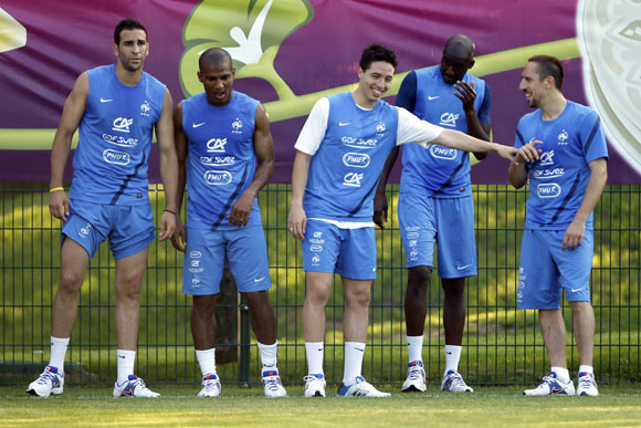 France's soccer players (From L) Adil Rami, Florent Malouda, Samir Nasri, Alou Diarra and Franck Ribery attend a training session at the team's training center in Kircha near Donetsk June 12, 2012. France drew 1-1 with England in their Group D Euro 2012 soccer match yesterday in Donetsk