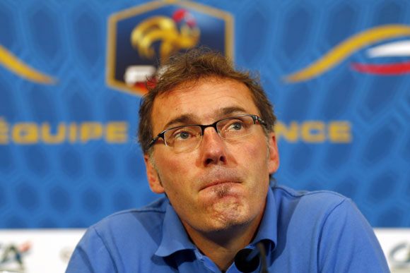 France's coach Laurent Blanc reacts during a news conference in Donetsk