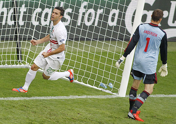 Portugal's Helder Postiga celebrates after scoring a against Denmark on Wednesday