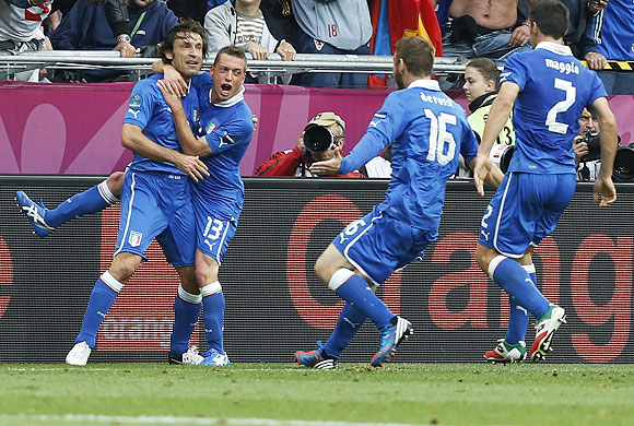 Italy's Andrea Pirlo (left) is congratulated by teammates after scoring against Croatia