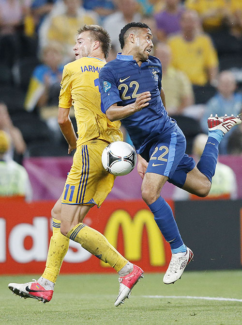 Ukraine's Andriy Yarmolenko (left) and France's Gael Clichy vie for possession