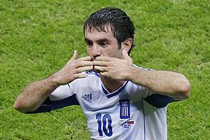 Greece's Giorgos Karagounis celebrates his goal against Russia on Saturday