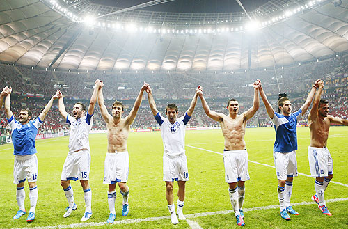 Greece's players celebrate victory against Russia