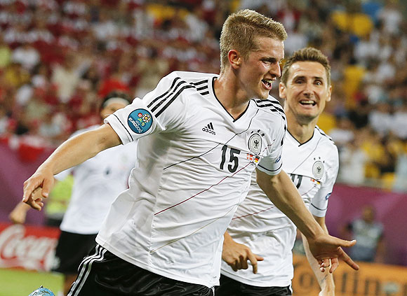 Germany's Lars Bender (left) celebrates with Miroslav Klose after scoring against Denmark
