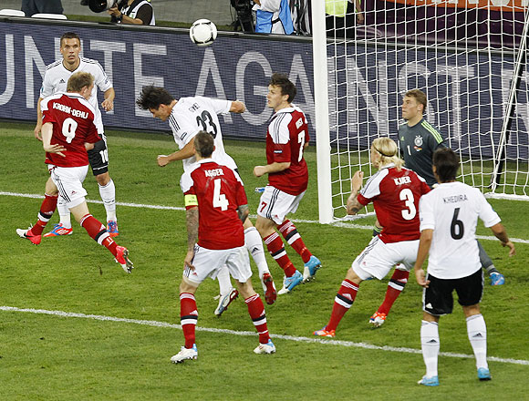 Denmark's Michael Krohn-Dehli (2nd from left) heads to score against Germany