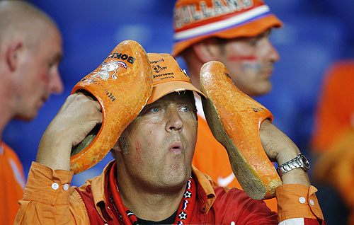 A Netherlands fan reacts after the Dutch lost to Portugal
